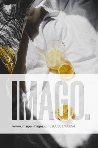 A closeup of a lemon juice with lemons on the bed *** einer closeupe des einer Zitrone Saft mit Zitronen am der Bett 4983755 RECORD DATE NOT STATED