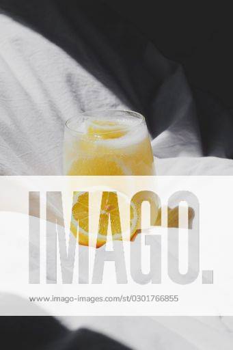 A closeup of a lemon juice with lemons on the bed *** einer closeupe des einer Zitrone Saft mit Zitronen am der Bett 4983757 RECORD DATE NOT STATED