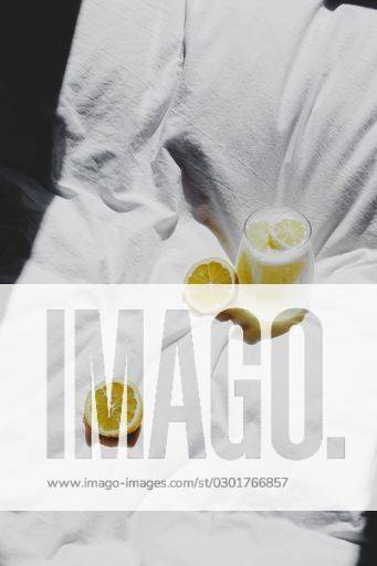 A closeup of a lemon juice with lemons on the bed *** einer closeupe des einer Zitrone Saft mit Zitronen am der Bett 4983760 RECORD DATE NOT STATED