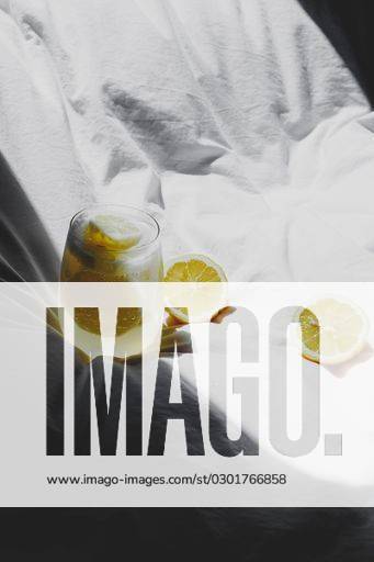 A closeup of a lemon juice with lemons on the bed *** einer closeupe des einer Zitrone Saft mit Zitronen am der Bett 4983764 RECORD DATE NOT STATED