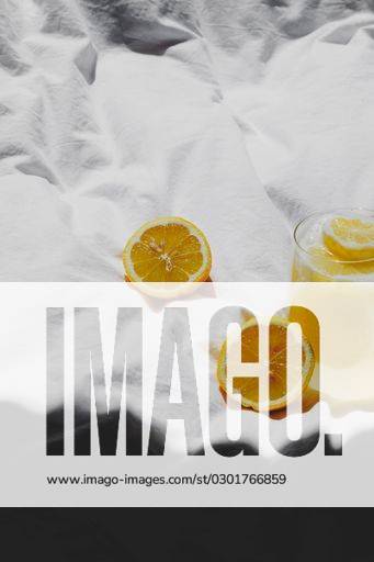 A closeup of a lemon juice with lemons on the bed *** einer closeupe des einer Zitrone Saft mit Zitronen am der Bett 4983765 RECORD DATE NOT STATED