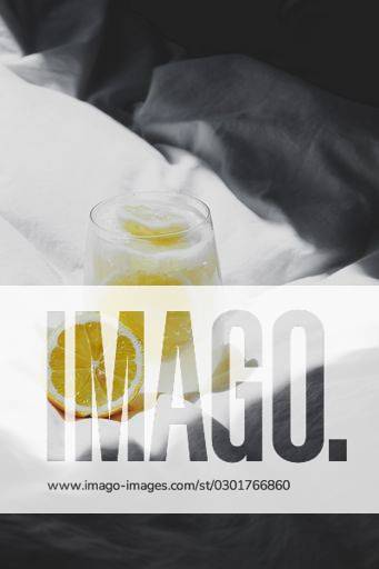 A closeup of a lemon juice with lemons on the bed *** einer closeupe des einer Zitrone Saft mit Zitronen am der Bett 4983766 RECORD DATE NOT STATED