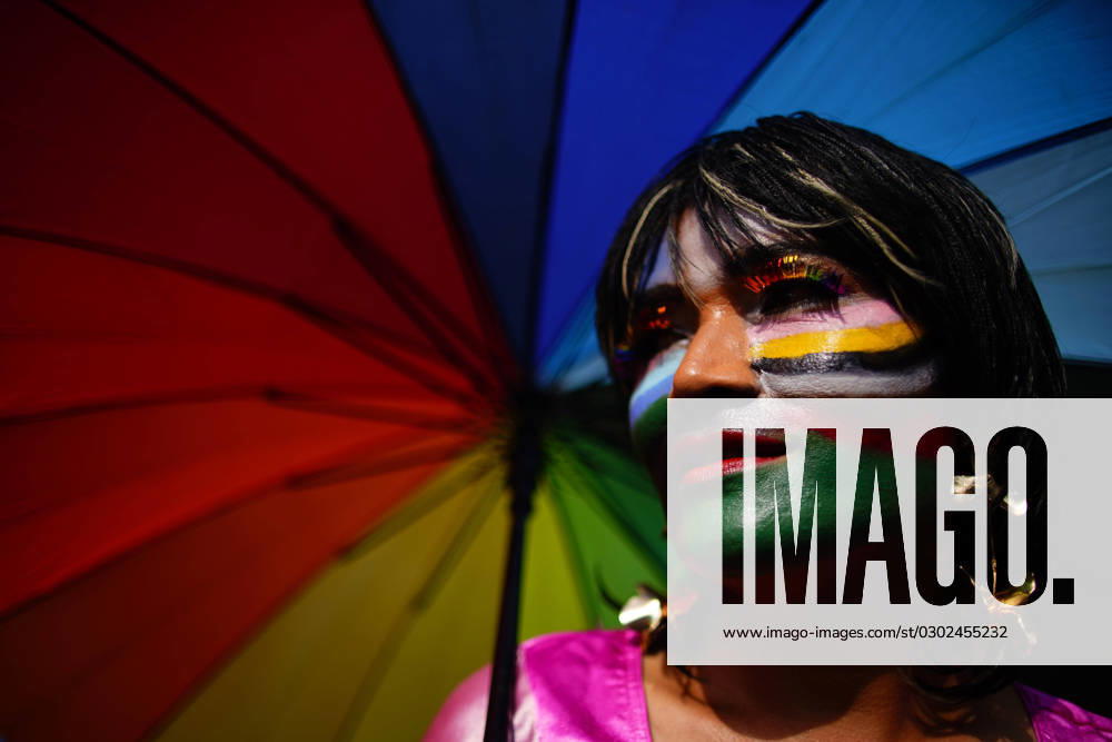 A participant from the LGBTIQIA+ community holds an umbrella while taking part in the pride parade celebrations in Kathmandu, Nepal. Nepal s vibrant LGBTQIA+ community and supporters join hands and hearts each year for a spectacular celebration of love, acceptance, and inclusivity during the annual Pride Parade coinciding with the Gai Jatra festival where people commemorate the festival to wish peace for their deceased family members from the previous years. Kathmandu Nepal - ZUMAg200 20230831_zap_g200_003