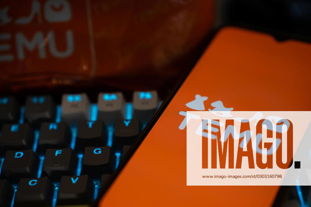 Temu Marketplace Stock Photo Illustrations A mobile phone over a keyboard is seen with the logo of Temu on its screen. Athens Greece