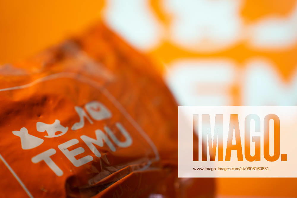 Temu Marketplace Stock Photo Illustrations A package from Temu is seen in front of a screen with the Temu logo. Athens Greece