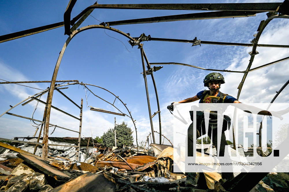 ZAPORIZHZHIA REGION, UKRAINE - SEPTEMBER 14, 2023 - A journalist is seen on the premises of an agricultural enterprise destroyed in the shelling of Russian troops near Orikhiv, Zaporizhzhia Region, southeastern Ukraine. Agricultural enterprise near Orikhiv destroyed by Russians