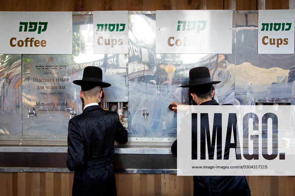 UMAN, UKRAINE - SEPTEMBER 16, 2023 - Hasidic pilgrims have coffee and biscuits during the celebration of Rosh Hashanah, the Jewish New Year, Uman, Cherkasy Region, central Ukraine. Rosh Hashanah celebration in Uman