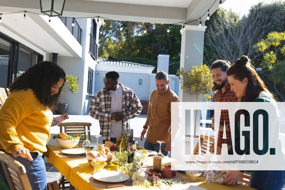 Happy diverse male and female friends serving thanksgiving celebration meal in sunny garden Happy diverse male and female friends serving thanksgiving celebration meal in sunny garden. Celebration, friendship, patriotism, american culture and tradition, unaltered., model released, , property released, Cape Town, South Africa, 07.09.2023, 4193321.jpg, people,happy,diverse,male and female,friend,serving,thanksgiving,celebration,meal,sunny,garden,friendship,patriotism,american culture,tradition,unaltered,holiday,patriotic,dinner,fun,nation,young,lunch,happiness,together,beautiful,spring,summer,party,food,traditional,season,christmas,cheerful,decoration,flag,male,female,american,culture Mid Adult,Man,Male,Black,Woman,Female,Multiracial,White,M