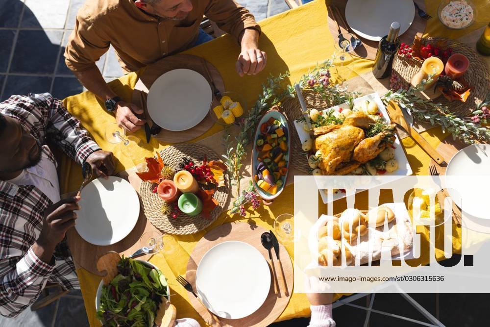 Happy diverse male and female friends serving thanksgiving celebration meal in sunny garden Happy diverse male and female friends serving thanksgiving celebration meal in sunny garden. Celebration, friendship, patriotism, american culture and tradition, unaltered., model released, , property released, Cape Town, South Africa, 07.09.2023, 4193330.jpg, people,happy,diverse,male and female,friend,serving,thanksgiving,celebration,meal,sunny,garden,friendship,patriotism,american culture,tradition,unaltered,holiday,patriotic,dinner,fun,nation,young,lunch,happiness,together,beautiful,spring,summer,party,food,traditional,season,christmas,cheerful,decoration,flag,male,female,american,culture Mid Adult,Man,Male,Black,Mature Adult,White,Woman,Female,