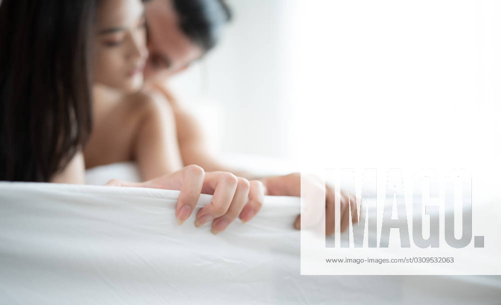 Gorgeous sexy couple enjoying arousing sex before having sex on bed in home bedroom The concept of emotional and love relationships. Gorgeous sexy couple enjoying arousing sex before having sex on bed in home bedroom The concept of emotional and love relationships. ,model released, Symbolfoto