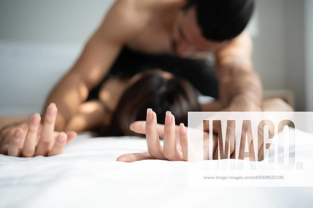 Gorgeous sexy couple enjoying arousing sex before having sex on bed in home bedroom The concept of emotional and love relationships. Gorgeous sexy couple enjoying arousing sex before having sex on bed in home bedroom The concept of emotional and love relationships. ,model released, Symbolfoto