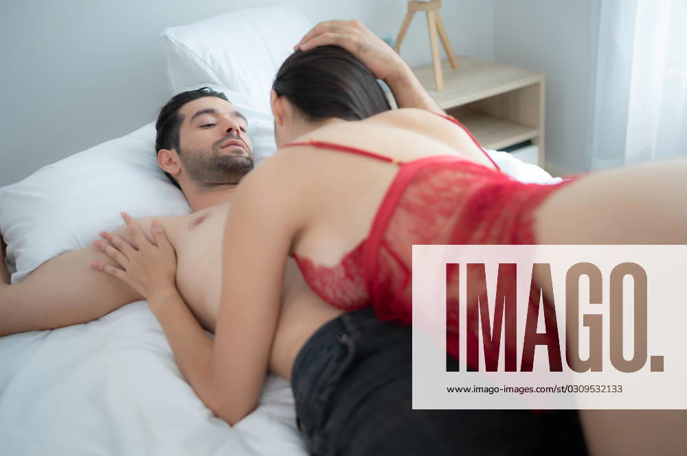 Gorgeous sexy couple enjoying arousing sex before having sex on bed in home bedroom The concept of emotional and love relationships. Gorgeous sexy couple enjoying arousing sex before having sex on bed in home bedroom The concept of emotional and love relationships. ,model released, Symbolfoto