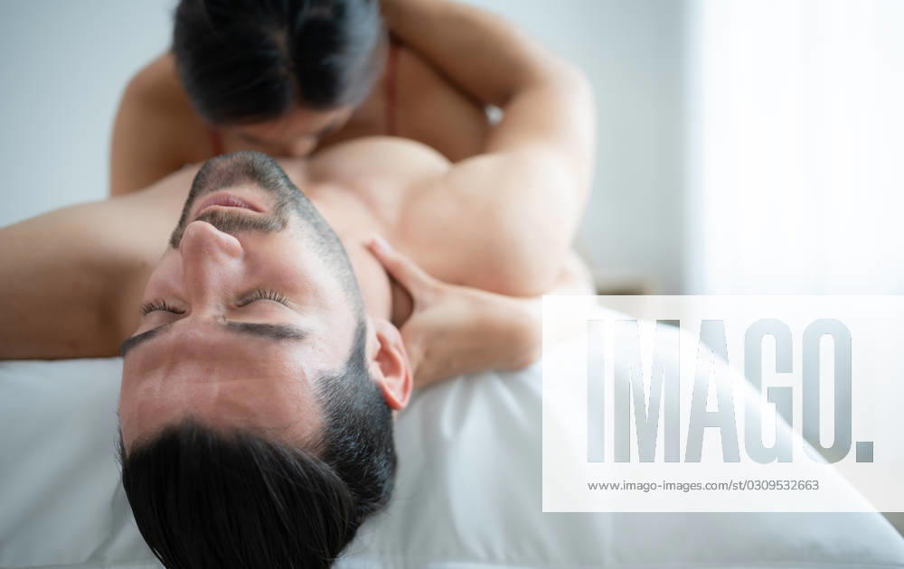 Gorgeous sexy couple enjoying arousing sex before having sex on bed in home bedroom The concept of emotional and love relationships. Gorgeous sexy couple enjoying arousing sex before having sex on bed in home bedroom The concept of emotional and love relationships. ,model released, Symbolfoto