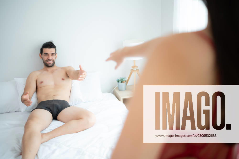 Gorgeous sexy couple enjoying arousing sex before having sex on bed in home bedroom The concept of emotional and love relationships. Gorgeous sexy couple enjoying arousing sex before having sex on bed in home bedroom The concept of emotional and love relationships. ,model released, Symbolfoto