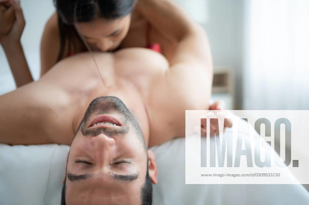 Gorgeous sexy couple enjoying arousing sex before having sex on bed in home bedroom The concept of emotional and love relationships. Gorgeous sexy couple enjoying arousing sex before having sex on bed in home bedroom The concept of emotional and love relationships. ,model released, Symbolfoto