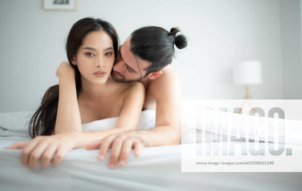 Gorgeous sexy couple enjoying arousing sex before having sex on bed in home bedroom The concept of emotional and love relationships. Gorgeous sexy couple enjoying arousing sex before having sex on bed in home bedroom The concept of emotional and love relationships. ,model released, Symbolfoto
