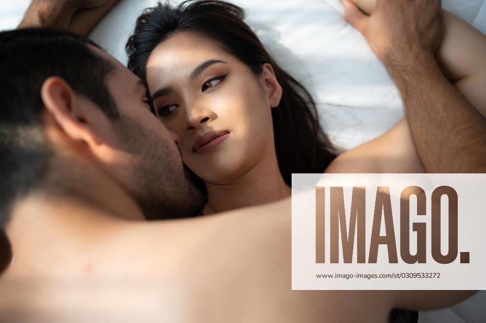 Gorgeous sexy couple enjoying arousing sex before having sex on bed in home bedroom The concept of emotional and love relationships. Gorgeous sexy couple enjoying arousing sex before having sex on bed in home bedroom The concept of emotional and love relationships. ,model released, Symbolfoto
