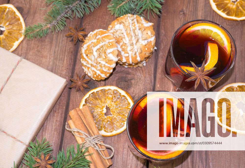 Mulled wine and spices on a wooden background with branches of a Christmas tree. Selective focus. , 41080406.jpg, christmas, newyear, wine, cinnamon, drink, anise, glass, spice, cup, holiday, red, fruit, hot, sweet, warm, wooden, traditional, decoration, food, alcohol, clove, mulled, homemade, delicious, winter, orange, star, beverage, punch, aromatic, flavor, aroma, seasonal, spruce, advent, lighting, season, slice, grog, xmas, heat, lemon, mug, mulled wine, nobody, bright, wood, selective focus, stick, vertical RECORD DATE NOT STATED