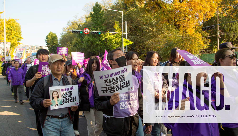 Itaewon tragedy, Oct 29, 2023 : A family member (L) of a victim of the Itaewon crowd crush, holds a photo of the perished during a protest march at Itaewon street in Seoul, South Korea. Thousands of people and family members of the victims gathered in central Seoul to cherish the memories of the deceased at a memorial event marking the first anniversary of the deadly Itaewon crowd crush that claimed 159 lives last year. They demanded a probe into the disaster and punishment of officials found responsible for the tragedy. , aflo_234055175.jpg,