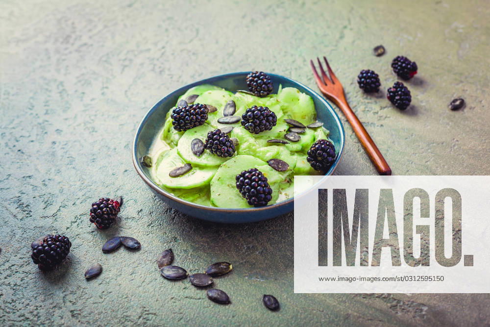 Cucumber salad with blackberries and yogurt dressing and seeds Cucumber salad with blackberries and yogurt dressing and seeds
