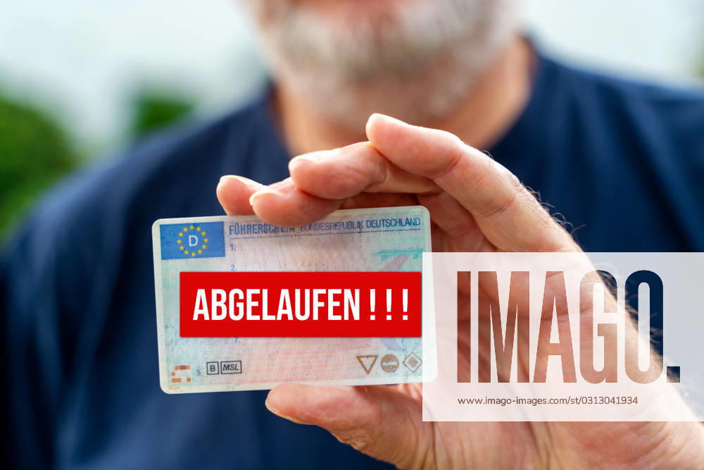 An old man with a beard holds a driver s license in his hand with the inscription Expired PHOTOMONTAGE