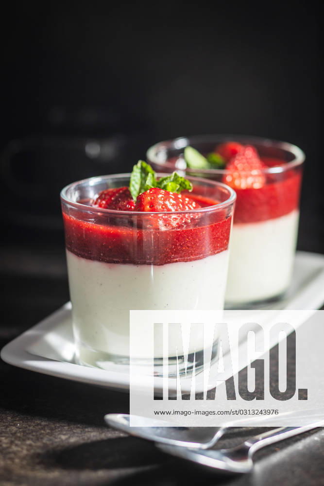 Italian dessert panna cotta with strawberries Italian dessert panna cotta in glass with strawberries.