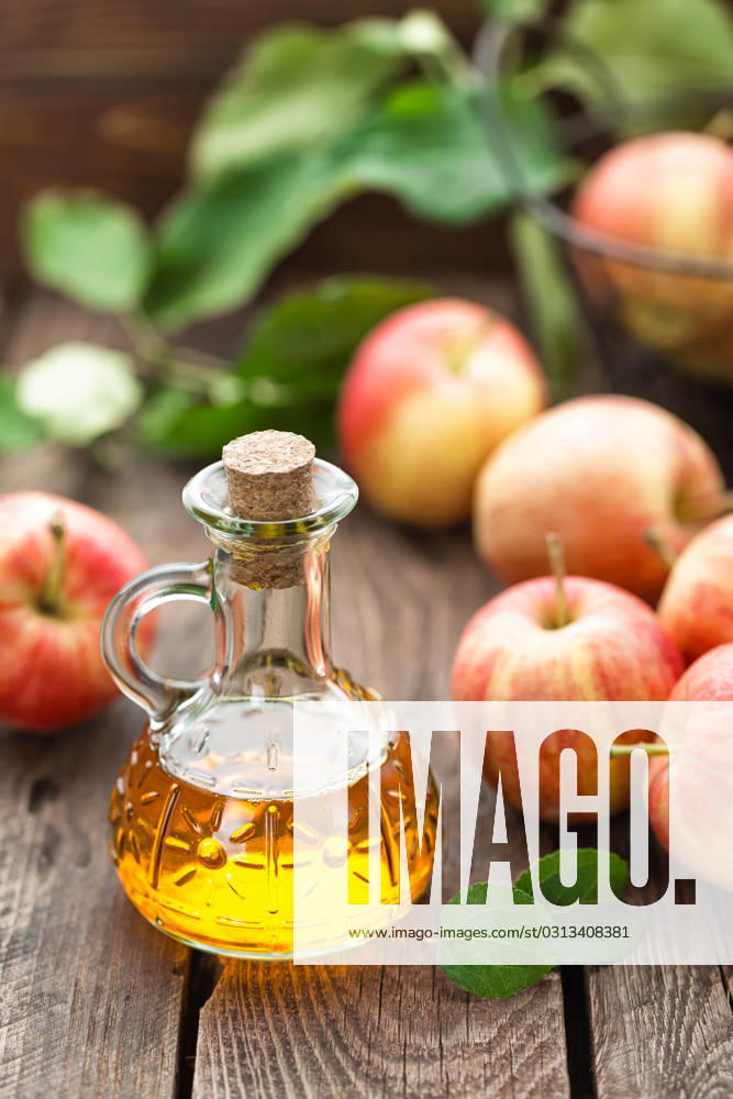 Apple vinegar , 23022774.jpg, vinegar, apple, bottle, glass, fruit, healthy, food, fresh, organic, ingredient, background, liquid, wooden, acid, cooking, dressing, table, natural, rustic, nutrition, leaf, sour, raw, cuisine, kitchen, apple vinegar, RECORD DATE NOT STATED
