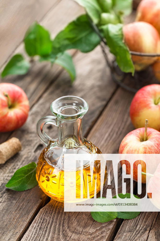 Apple vinegar , 23022780.jpg, vinegar, apple, bottle, glass, fruit, healthy, food, fresh, organic, ingredient, background, liquid, wooden, acid, cooking, dressing, table, natural, rustic, nutrition, leaf, sour, raw, cuisine, kitchen, apple vinegar, RECORD DATE NOT STATED