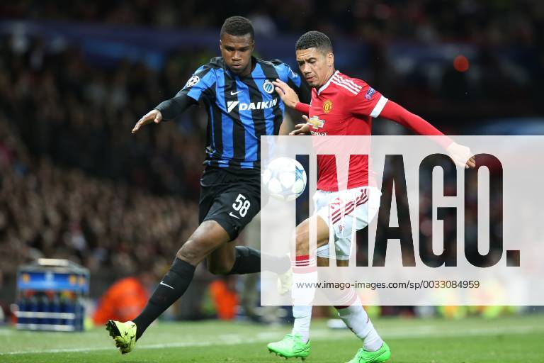 - MANCHESTER, UNITED KINGDOM: Club s Obbi Oulare and Manchester s Chris Smalling fight for the ball during a soccer game between British club Manchester United ManU FC and Belgian team Club Brugge KV in Manchester, United Kingdom, Tuesday 18 August 2015, the first leg of the play-offs for the UEFA Champions League competition. BRUNOxFAHY x84381904x