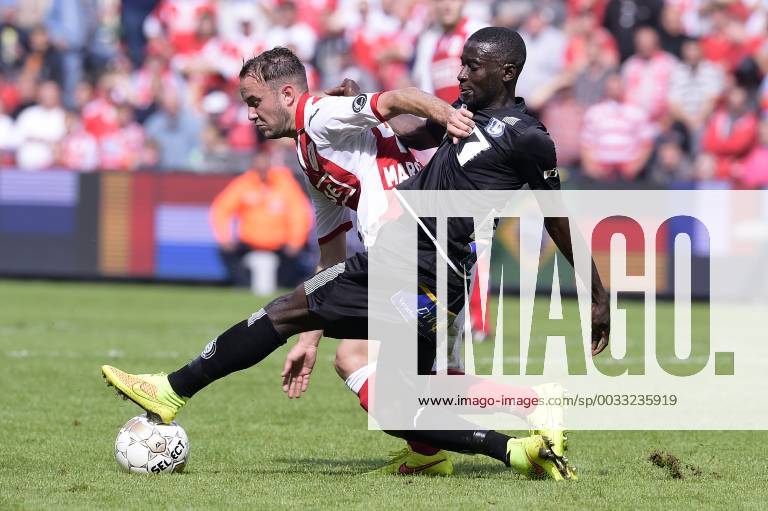 - LIEGE, BELGIUM: Standard d Francois Marquet and Gent s Nana Asare fight for the ball during the Jupiler Pro League match between Standard de Liege and AA Gent, in Liege, Sunday 10 August 2014, on the third day of the Belgian soccer championship. YORICKxJANSENS x61000568x