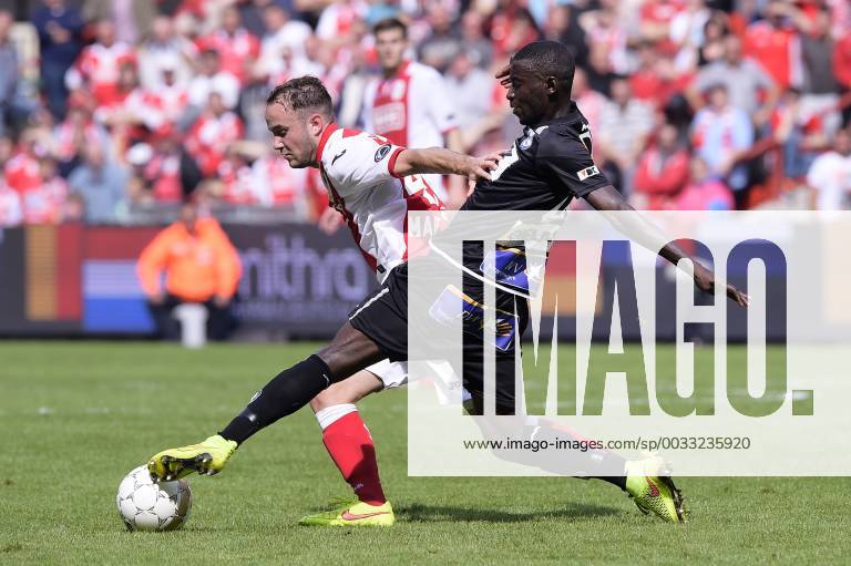 - LIEGE, BELGIUM: Standard d Francois Marquet and Gent s Nana Asare fight for the ball during the Jupiler Pro League match between Standard de Liege and AA Gent, in Liege, Sunday 10 August 2014, on the third day of the Belgian soccer championship. YORICKxJANSENS x61000571x
