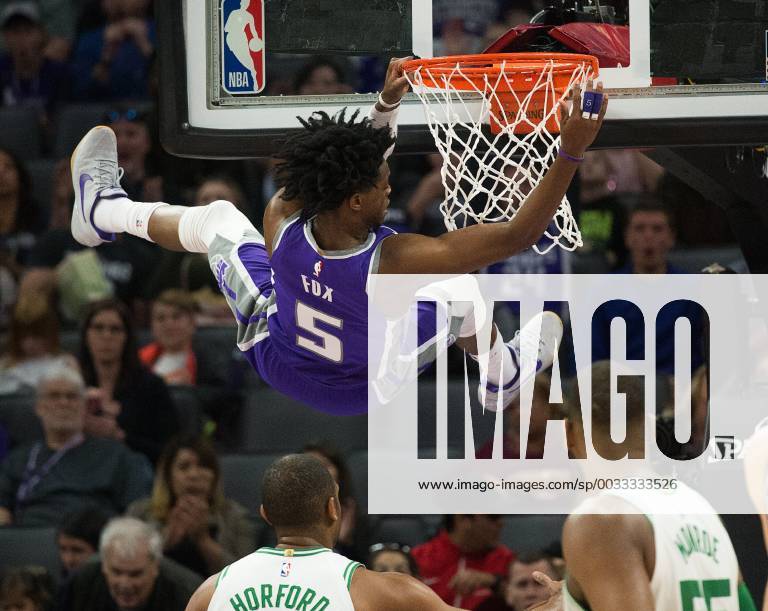 - SPORT March 25, 2018 - Sacramento, CA, USA - Sacramento Kings guard De Aaron Fox (5) hangs on the basket after scoring against the Boston Celtics on Sunday, March 25, 2018 at Golden 1 Center in Sacramento, Calif. Boston Celtics vs. Sacramento Kings - ZUMAm67_ 20180325_zaf_m67_049