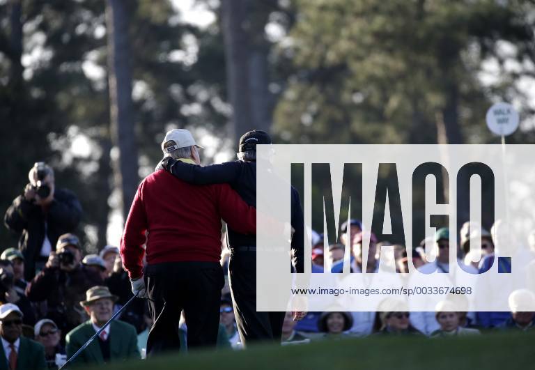 Honorary Starters Jack Nicklaus and Gary Player of South Africa walk off of the tee box together after hitting a tee shot on the first hole before the 1st round of the 2018 Masters Tournament at the Augusta National Golf Club in Augusta, Georgia, on April 5, 2018. AUG20180405101 JOHNxANGELILLO