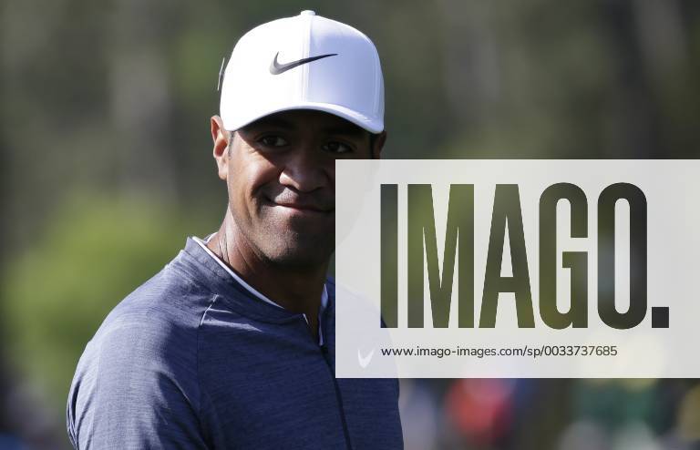 Tony Finau smiles at patrons as he walks up the fairway on the 3rd hole in the 2nd round of the 2018 Masters Tournament at the Augusta National Golf Club in Augusta, Georgia, on April 6, 2018. AUG20180406109 JOHNxANGELILLO