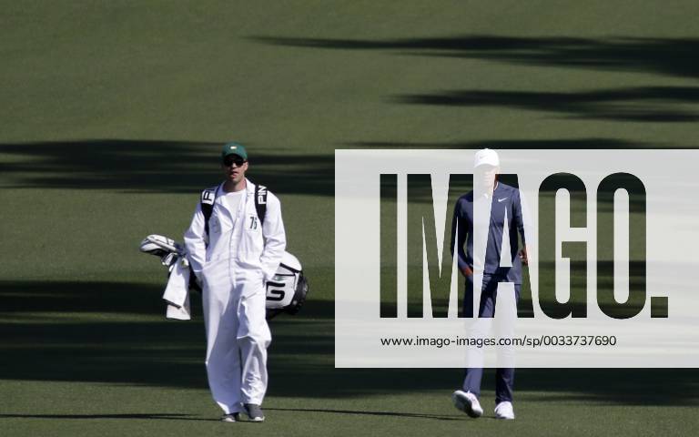 Tony Finau walks with caddie Greg Bodine in the 2nd round of the 2018 Masters Tournament at the Augusta National Golf Club in Augusta, Georgia, on April 6, 2018. AUG20180406116 JOHNxANGELILLO