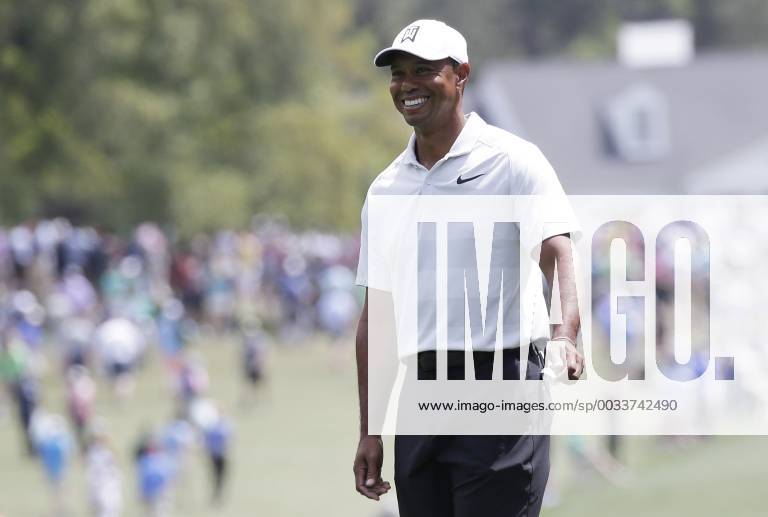Tiger Woods smiles on the first hole fairway after his tee shot in the 2nd round of the 2018 Masters Tournament at the Augusta National Golf Club in Augusta, Georgia, on April 6, 2018. AUG20180406121 JOHNxANGELILLO