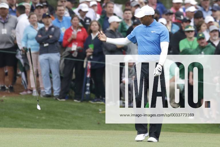 Tiger Woods tosses his club after he hits his approach shot to hole 15in the 3rd round of the 2018 Masters Tournament at the Augusta National Golf Club in Augusta, Georgia, on April 7, 2018. AUG20180407114 JOHNxANGELILLO