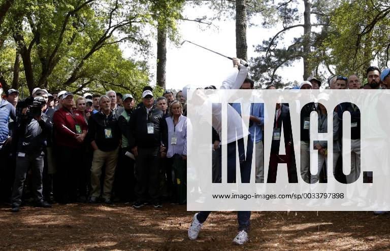 Rory McIlroy hits his approach shot from the rough to the 1st hole in the final round of the 2018 Masters Tournament at the Augusta National Golf Club in Augusta, Georgia, on April 8, 2018. AUG20180408110 JOHNxANGELILLO