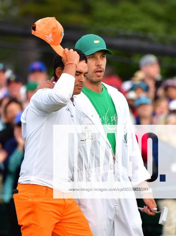 Rickey Fowler is reacts next to his caddie Joe Skovron after finishing his final round of the 2018 Masters Tournament at the Augusta National Golf Club in Augusta, Georgia, on April 8, 2018. Fowler finished second with 14-under-par AUG20180408336 KEVINxDIETSCH