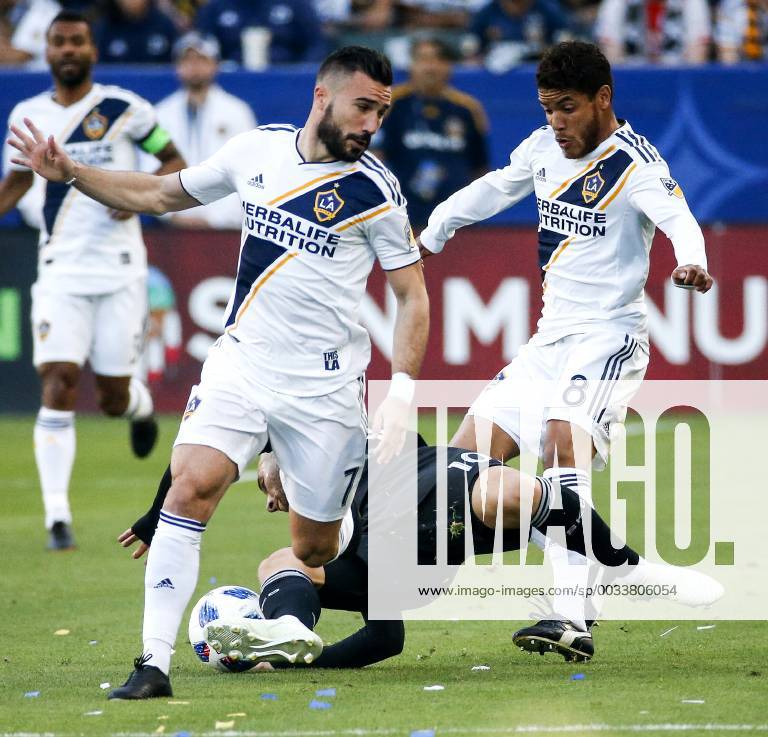 Los Angeles, California, U.S - Sporting Kansas Citys forward Yohan Croizet (10) of France, falls between Los Angeles Galaxys midfielder Romain Alessandrini (7) of France and Los Angeles Galaxys midfielder Jonathan dos Santos (8) during the 2018 Major League Soccer MLS Fussball Herren USA match between Los Angeles Galaxy and Sporting Kansas City in Carson, California, April 8, 2018. Sporting Kansas City won 2-0. MLS 2018: Los Angeles Galaxy 0-2 Sporting Kansas City - ZUMAc68_ 20180408_zaf_c68_033