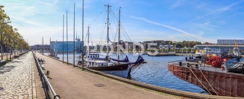 High resolution panorama of the port of Kiel in Germany on a sunny day architecture, blue, bridge, budapest, buildings, city, cityscape, clouds, europe, folk festival, germany, harbour, high resolution, kiel, kiel fjord, kiel sailing city, kiel week, landmark, landscape, maritime, night, nobile, panorama, port, regatta escort, river, sailing ship, sea, ship, ships, sky, skyline, stockholm, summer, sun, sunny, sunset, tourism, town, transport, travel, travel photography, urban, view, water, windjammer parade