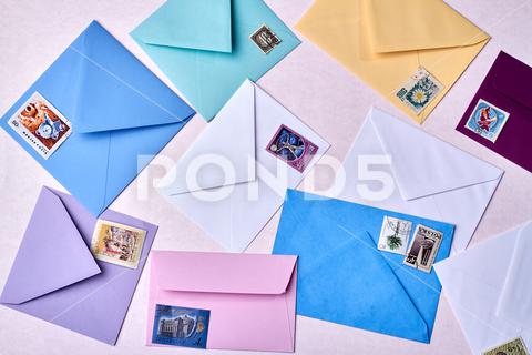 Envelopes with post stamps. Pile of letters isolated on white background. communication, card, paper, envelopes, arrangement, post, stamp, letters, pile, mail, postage, design, mark, sign, symbol, old, send, background, white, vintage, correspondence, isolated, label, postal, print, set, blank, letter, retro, business, empty, stamps, air, fly, shape, art, message, border, corner, yellow, template, many, world, sending, personal, office, postcard, flatlay, composition