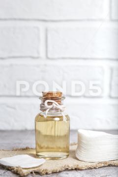 Mockup glass bottle with lotion and cotton pads for skin beauty care. Natural homemade cosmetic product, essential oil. Front view. cosmetic, bottle, lotion, beauty, care, mockup, background, skin, natural, spa, whey, apple cider vinegar, product, clean, cotton pad, treatment, tonic, health, white, body, hygiene, organic, face, moisturizer, liquid, facial, pad, cotton, container, healthy, oil, serum, wash, cleansing, cleanser, makeup, herbal, glass, water, fresh, copy space, concept, wellness, package, object, medical, essential, skincare, beautiful, essence