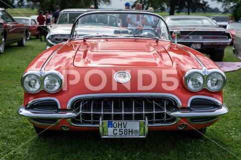 The sports car Chevrolet Corvette (C1), 1958. The exhibition of "US Car Classics". machine, luxury, red, exhibition, diedersdorf, 2-door, america, american, ancient, antique, auto, automobile, automotive, c1, cabrio, cabriolet, car, chevrolet, classic, convertible, corvette, design, front, germany, iconic, model, nostalgia, old, oldtimer, retro, shine, sports car, style, transport, us, usa, vehicle, vette, vintage