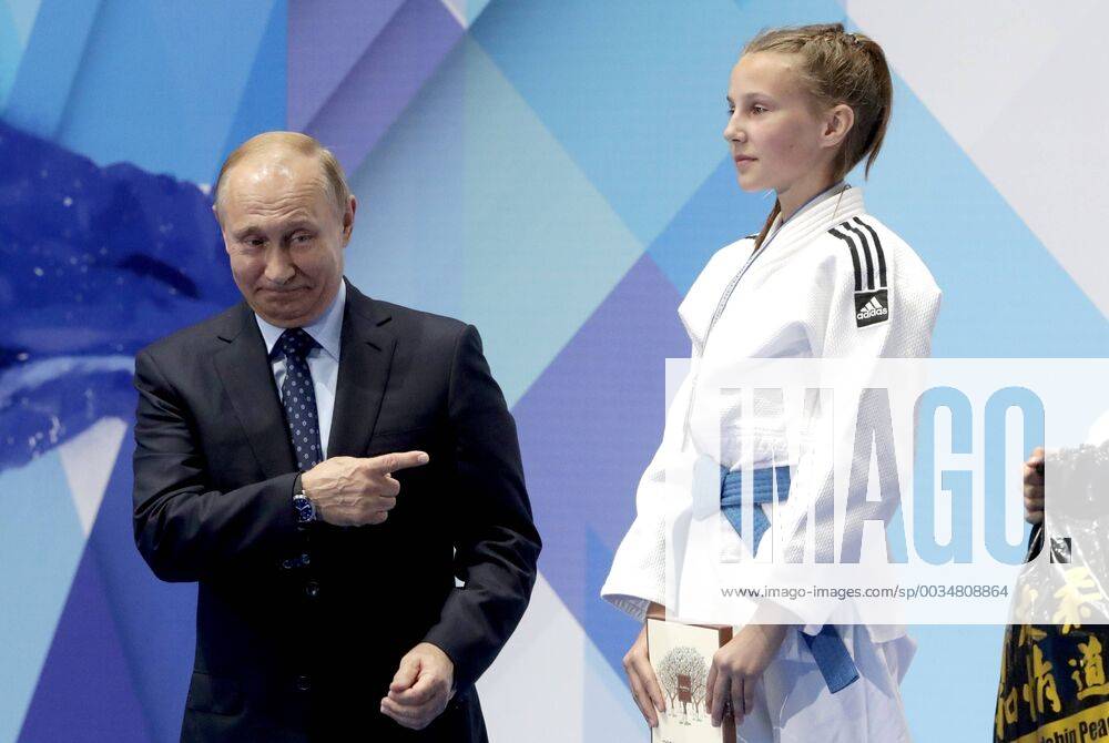 - SPORT ST PETERSBURG, RUSSIA - MAY 23, 2018: Russia s President Vladimir Putin (L) congratulates prizewinners at the 2018 Youth Judo Tournament dedicated to Soviet and Russian judo coach Anatoly Rakhlin, and held at St Petersburg s Yubileyny Palace of Sports. Mikhail Metzel TASS 83315947st