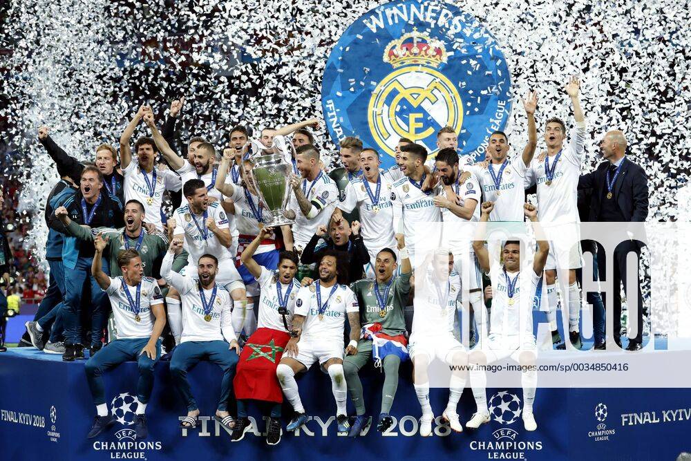 Goalkeeper Keylor Navas of Real Madrid, Daniel Carvajal of Real Madrid, Sergio Ramos of Real Madrid, Raphael Varane of Real Madrid, Cristiano Ronaldo of Real Madrid, Toni Kroos of Real Madrid, Karim Benzema of Real Madrid, Luka Modric of Real Madrid, Marcelo of Real Madrid, Casemiro of Real Madrid, Isco of Real Madrid, goalkeeper Kiko Casilla of Real Madrid, Nacho of Real Madrid, Gareth Bale of Real Madrid, Theo Hernandez of Real Madrid, Lucas Vazquez of Real Madrid, Marco Asensio of Real Madrid, Mateo Kovacic of Real Madrid, coach Zinedine Zidane of Real Madrid, with UEFA Champions League trophy, Coupe des clubs Champions Europeens during the UEFA Champions League final between Real Madrid and Liverpool on May 26, 2018 at NSC Olimpiyskiy Stadium in Kyiv, Ukraine UEFA Champions League 2017 2018 Imagesx xMauricexvanxSteenxIVx 11045003