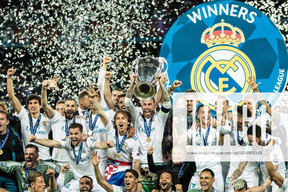 (180527) -- KIEV, May 27, 2018 -- Sergio Ramos (C) of Real Madrid holds the trophy after winning the UEFA Champions League final match between Liverpool and Real Madrid in Kiev, Ukraine on May 26, 2018. Real Madrid claimed the title with 3-1. ) (SP)UKRAINE-KIEV-CHAMPIONS LEAGUE-LIVERPOOL-REAL MADRID Wuzhuang