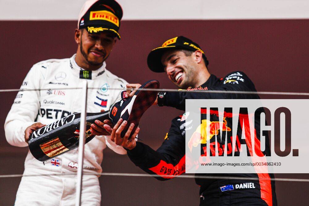 Montecarlo, Monaco - 44 Lewis Hamilton from Great Britain Mercedes W09 Hybrid EQ Power+ team Mercedes GP helping the winner 03 Daniel Ricciardo from Australia with Aston Martin Red Bull Tag Heuer RB14 to do a showy during the Race of Monaco Formula One Grand Prix at Monaco on 27th of May, 2018 in Montecarlo, Monaco. F1 Grand Prix of Monaco - ZUMAn230 20180527_zaa_n230_652