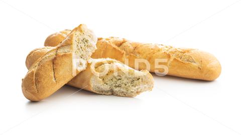 Roasted baguette with garlic butter. Crunchy sliced garlic bread isolated on white background. baguette, garlic, food, bread, appetizer, fresh, homemade, snack, herb, baked, french, italian, vegetarian, slice, grilled, toast, tasty, crusty, crispy, sliced, oil, butter, dish, meal, dinner, parsley, breakfast, closeup, basil, rustic, crunchy, nobody, toasted, lunch, buttered, chopped, garlic bread, roasted, rosemary, isolated, white, background, cutout, cut, out, isolate, isole