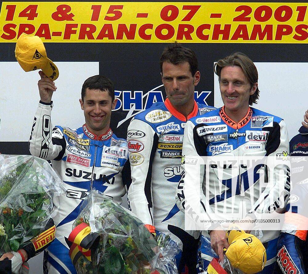 BRU17 - - FRANCORCHAMPS, BELGIUM : From L-R Britt pilots L Brian, Brian Morrison and French Christian Lavieille celebrate on th podium after winning the 24H Moto of Liege, Sunday 15 July 2001 at the circuit of Spa - Francorchamps. GUYxMOSSAY x673939x